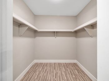 A room with wooden floors and white walls.